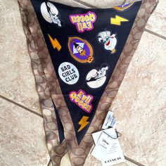 an upside down pennant with various stickers on it