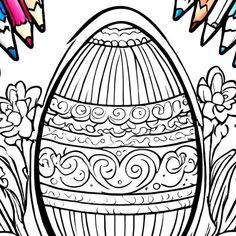 an easter egg with some crayons around it