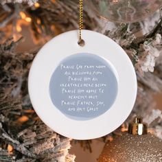 an ornament hanging from a christmas tree with a poem written on the front