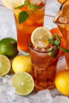 three glasses filled with iced tea and mint garnish