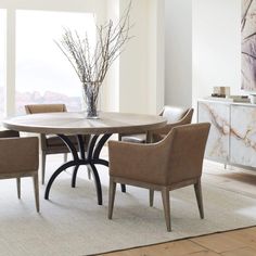 a dining room table with chairs around it