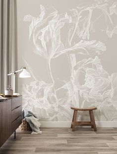 a white flower wallpaper in a bedroom with a wooden stool and lamp on the side