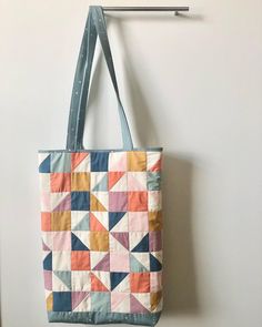 "You will love either of these roomy tote bags! They are perfect for carrying books, your laptop, kid toys & supplies - anything really!  They are generously sized to carry all your essentials and look fabulous at the same time!  Both totes feature an interior pocket so your smaller items are easy to find.   Hint: Tote bags make great gifts!! 2 options: Stripes: 17.5\" x 13\" x 2.5\" Squares/Triangles: 17\" x 10.5\" x 3\" Both totes are made with 100% quilters cotton in a variety of colors and are quilted and lined." Back To School Tote Bag With Adjustable Strap, Rectangular Diaper Bag For Back To School, Rectangular Everyday Bags For Back To School, Everyday Rectangular Bags For Back To School, Playful Everyday Bags For Back To School, Rectangular Bags For Back To School Shopping, Rectangular Shopping Bag For Back To School, Rectangular Shopping Bags For Back To School, Cute Softback Shoulder Bag For Everyday Use