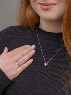 💕 Share your belief in love with the world through the Sparkling Pink Elevated Heart Ring. Featuring a heart-shaped pink artificial crystal nestled within its mount, surrounded by a dazzling pavé setting on the front of the band, this ring exudes elegance and charm. Elevate your style by pairing it with Pandora Timeless' pink Heart pendant and other timeless jewelry pieces. Let its beauty captivate all who behold it. 💖✨ Crafted with care, the 'Pandora Necklace' is the perfect choice for any occasion, be it birthdays, anniversaries, or simply to show appreciation to the remarkable woman in your life. Whether she's a nurturing mother, a loyal sister, a cherished friend, or a beloved partner, this necklace offers a personalized and heartfelt token of gratitude. Its design, inspired by the e Pandora Pink Heart Necklace, Pink Heart-shaped Gemstone Jewelry, Pink Gemstone Heart Necklace, Pink Birthstone Heart Pendant Necklace, Pink Cubic Zirconia Heart Necklace, Pink Heart Cut Cubic Zirconia Necklace, Pink Double Heart Jewelry Gift For Her, Pink Gemstone Jewelry For Valentine's Day, Pink Heart Cut Jewelry As Gift For Her