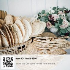 some baskets and flowers are sitting on a table with the qr code to see them details