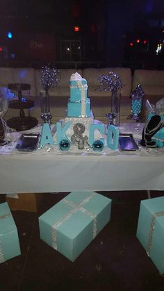 a table topped with blue and white cakes