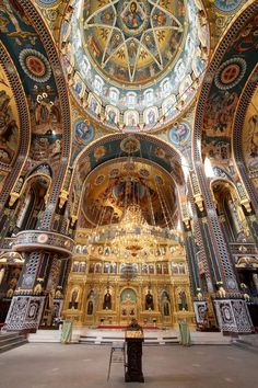 the interior of an ornate church with painted ceilings