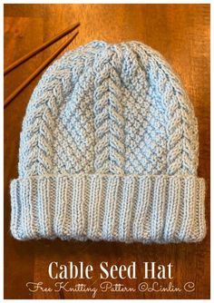 the cabled beanie is knitted and ready to be used as a hat