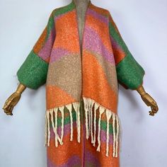 This super soft and warm wool cardigan kimono is perfect for the cold weather. Unlike other sweaters and wools, the wool used for this beauty is non itchy. Think of your favorite throw blanket, the comfort and warmth it gives but 10x stylish and wearable any where. This kimono is all that and more! One size fits S-4X Material: Wool One Size Fits Most Size Chart Wool Shawl Outerwear For Winter, One Size Winter Acrylic Sweater Coat, Wool Knit Sweater Coat For Fall, One Size Acrylic Sweater Coat For Winter, Fall Wool Sweater Coat With Knit Fabrication, One Size Soft Knit Acrylic Outerwear, Multicolor Warm Outerwear For Fall, Warm Multicolor Outerwear For Fall, One Size Wool Outerwear For Winter