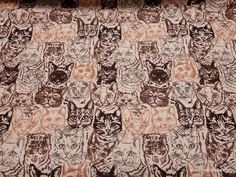 an image of cats that are on the bed sheet in this room or playroom