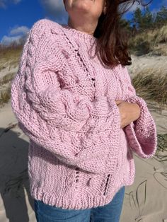 Super warm, soft and cozy handknit chunky oversized wool autumn/winter sweater, decorated with a pattern of braids and bubbles. The soft pink color makes it super cute.  GIFT  Sweater is also a great choice for gift, we pack it nicely. We are sure handmade sweater will become your loved ones favourite! DETAILS * Super soft, premium quality yarn * 65% wool and 35% alpaca wool * Pattern * Oversized style * Handmade SIZE Oversized fit, model in the photo are M/L size Full length - 65cm/25inch Bust - 60-70cm/23-28inch Sleeve length from the neck - 75cm/29inch IMPORTANT * Each product is hand-knitted, so it may vary slightly from the one in the photos. ** Please note that the colors on your screens could be a little bit different then the real colors. CARE INSTRUCTIONS:  Wash by hands with wool Winter Cable Knit Pink Sweater, Winter Pink Cable Knit Sweater, Pink Cable Knit Sweater For Winter, Oversized Cozy Cable Knit Pattern, Cozy Oversized Cable Knit Pattern, Cozy Pink Cable Knit Sweater, Cozy Pink Sweater, Oversized Pink Knitted Sweater, Hand Knitted Pink Sweater For Fall