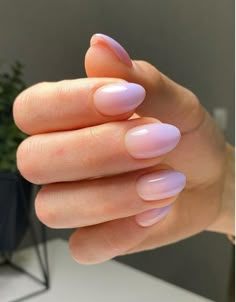 a woman's hand with long, pink nails