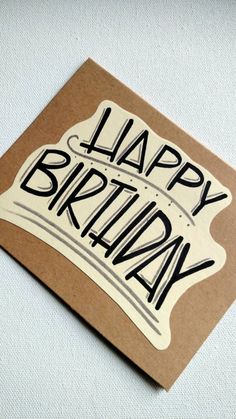 a birthday card with the words happy birthday written on it in black and white ink