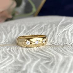 Bold and chic, star dome ring made in solid 14K yellow gold features three starburst, set with lab diamonds. Perfect to stack with our other rings. Please note this listing is ONLY for the three-starburst ring. Other rings shown in the picture are for styling purposes and can be found in our shop. https://www.etsy.com/ca/listing/1183039321/14k-gold-star-ring-north-star-band-ring?click_key=dd6677079af6a58f52eea809c4553675c50ad19a%3A1183039321&click_sum=2552eb4f&ref=shop_home_active_1&frs=1 * Mate Thick Gold Ring, Gold Dome Ring, Starburst Ring, Wide Band Ring, Full Eternity Ring, Dome Ring, Etsy Gold Ring, Gold Signet Ring, Diamond Star