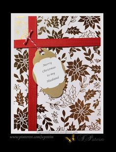 a card with a tag attached to it that says merry christmas and is decorated with flowers