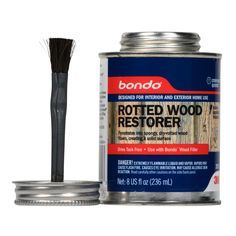 a can of wood restorer with a brush in the top and another tin on the bottom