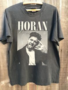 Comfort Color 90s Niall Horan concert shirt, Niall Horan shirt, Niall Horan The show shirt, Niall Horan fans Gift for men women shirt ABOUT MATERIAL: Comfort Colors® 1717 Made with medium fabric (6.1 oz/yd² (206.8 g/m consiting of high quality, 100% ring-spun US cotton for long-lasting comfort. The relaxed fit keeps the wearer comfy in both casual and semi-formal settings while the crew neckline delivers that classic, neat style which makes it perfect for accessorizing. What's more, the pre-shrunk fabric ensures a consistently great fit. Made using 100% US cotton that is ethically grown and harvested. Gildan is also a proud member of the US Cotton Trust Protocol ensuring ethical and sustainable means of production. How to wash Comfort Color :Machine wash: cold (max 30C or 90F); Do not blea Niall Horan Shirt, Niall Horan Concert, Niall Horan The Show, Koe Wetzel, Rap Shirt, Women Tshirt, Concert Shirts, Comfort Color, Tour Shirt