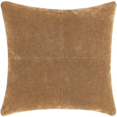 a brown pillow on a white background