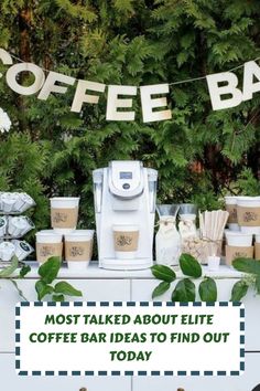 a coffee bar is set up with cups and paper garlands on the table in front of it