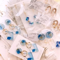 several pieces of jewelry are on display in plastic bags