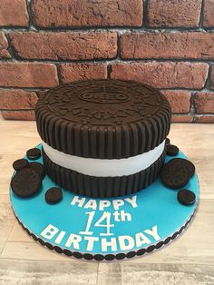 a birthday cake made to look like an oreo cookie