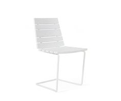 a white chair sitting on top of a metal frame