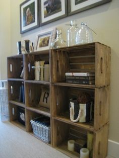 a wooden shelf filled with lots of books and other items on top of it's sides