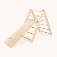 a wooden play set with a slide on the bottom and two pieces of wood attached to it