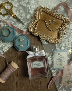 an assortment of jewelry and other items on a table