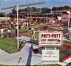 people are playing golf at the putt - putt course