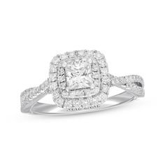 a square diamond ring with double halos and pave set diamonds on the band