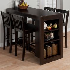 a dining table and chairs with baskets on it