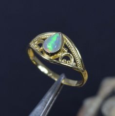 Welo Ethiopian Opal 925 Sterling Silver 18 Carat Gold Overlay Opal Ring ~ Gift For Anniversary ~ Natural Opal ~ Ring Size US ~ 6/ UK ~ L Weight of the Product :~ 1.5 Gram The Ring is stamped 925. We guarantee the quality and the genuine properties of silver and the stone. About Ethiopian Opal :~ Water absorption can alter the appearance of Ethiopian opal, changing the stone from opaque or semi-translucent to highly translucent and almost transparent! Shipping For the Product- All product are packed safely using either bubble wrap or Box to ensure 100% protection during Transit. SHIPPING TO UK - For Shipping we use Royal Mail which is fully trackable and the transit time is 2-3 working days after dispatch. If customers wish to receive Next day Delivery, Please use the EXPRESS option i.e. 8 Natural Opal Ring, Silver Opal Ring, Gift For Anniversary, Gold Overlay, Water Absorption, Opal Ring, Natural Opal, Opal Rings, Ethiopian Opal