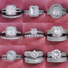 an assortment of diamond rings on pink velvet