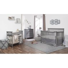 a baby's room with two cribs, a dresser and other furniture