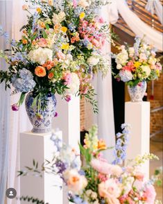 three vases filled with different types of flowers