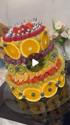 a cake made to look like fruit is sitting on a table