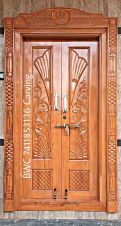 a wooden door with decorative carvings on it