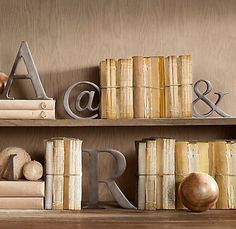 some books and letters are sitting on a shelf