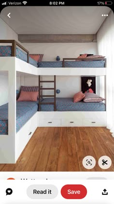 two bunk beds in a room with wooden floors and white walls, one is blue and the other has pink pillows