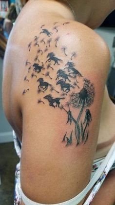 a woman with a dandelion tattoo on her shoulder