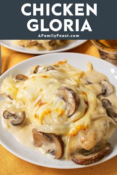 chicken glora with cheese and mushrooms on a white plate