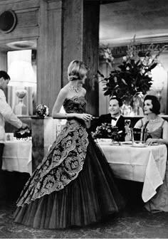 Modeling an evening dress by Carven at Taillevent, Paris, 1960. Photo: Philippe… Woman In A Dress, Vintage Gowns, Vintage Couture, 1960s Fashion, Moda Vintage, Vintage Vogue, 60s Fashion, Vintage Glamour