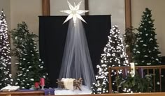 a church alter with christmas trees and decorations