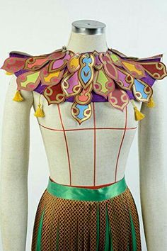 a dress made to look like a woman's torso with colorful designs on it