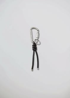 The Carabiner Keychain comes with a branded key ring and a leather rope detail. The screw lock ensures that items are securely secured. Made in aluminium it adds almost zero weight during the wear. Made in China100% Aluminium carabiner, key ring and metal cord ends100% Nappa leather ropeArticle number: X-30-1Branded lightweight aluminium carabinerBranded key ringDecorative leather rope with metal endsNot suitable for climbing activities Leather Charms, Key Carabiner, Chains Aesthetic, Carabiner Keychain, Art Jewelry Contemporary, Metal Keychain, Leather Key, Leather Keychain, Key Holder