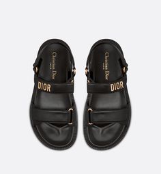 The black lambskin Dioract sandal has a modern silhouette. The style features an anatomical-shaped sole made with an ultra lightweight and comfortable leather. Scratch bands further enhanced by a gold-finish metal 'DIOR' signature on the superior band complete the design. The sandal will lend a contemporary touch to any look.. 36 Dioract Sandal, Dior Star, Dr Shoes, Icon Shoes, Dior Sandals, Dior Book Tote, Slides Sandals, Dior Shoes, Boot Pumps