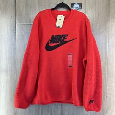 Nike Sportswear Essentials Sherpa Fleece Crew Sweater Condition: New With Tags Color: Red / Black Size: Large Style Code: Dd5017-657 Features - Nike Logo Stiching - Faux Fur 100% Polyester - Machine Washable Sporty Long Sleeve Fleece Jacket, Sporty Long-sleeved Fleece Jacket, Winter Fleece Sweatshirt For Sports, Nike Sporty Winter Sweatshirt, Sporty Nike Sweatshirt For Winter, Winter Sportswear Fleece Tops, Fleece Crew Neck Top With Fleece Lining, Long Sleeve Fleece Jacket For Sportswear, Red Athleisure Outerwear With Ribbed Cuffs