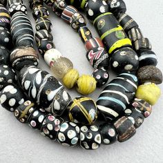 "A strand of various Venetian beads traded to Africa in the late 19th to early 20th century. A good variety of interesting beads in excellent to good condition. Assorted eye beads with a very nice Lewis and Clark bead. A few are chipped or cracked but most are very nice.  Nowadays the pickings are slim in Africa and the strands come with lots of fillers and many with condition issues.  \"As found\" in the marketplace in Upper Volta Over 50 years ago. 75 beads 27\" strand 61cm 6-12mm diameter .8 Antique Multicolor Beaded Necklaces, Antique Multicolor Beaded Necklaces With Round Beads, Antique Round Spacer Beads, Antique Hand-strung Oval Beads, Antique Oval Beads, Hand-strung Antique Oval Beads, African Trade Beads, Stone Wrapping, Lewis And Clark