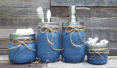 mason jars with toothbrushes and soap dispenser